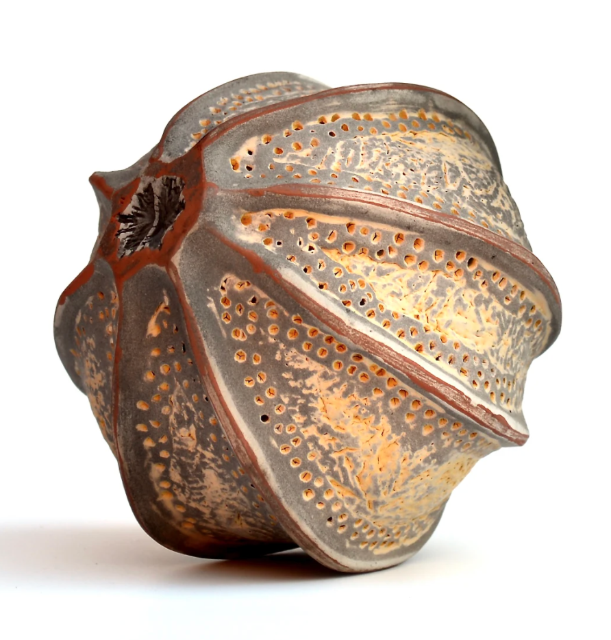 Seedpod sculpture with clay